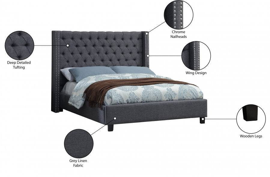 Sophisticated Grey Upholstered Wingback Bed with Button Tufting and Nailhead Trim